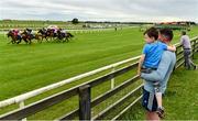 26 June 2020; Spectators Noah Murphy, age 6, from Kildare, and his uncle, Stuart, watch the action as the field pass during the Phoenix Of Spain Irish EBF Fillies Maiden during day one of the Dubai Duty Free Irish Derby Festival at The Curragh Racecourse in Kildare. Horse Racing continues behind closed doors following strict protocols having been suspended from March 25 due to the Irish Government's efforts to contain the spread of the Coronavirus (COVID-19) pandemic. Photo by Seb Daly/Sportsfile