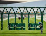 26 June 2020; A stall handler studies his notes following the start of the Irish Stallion Farms EBF (C & G) Maiden during day one of the Dubai Duty Free Irish Derby Festival at The Curragh Racecourse in Kildare. Horse Racing continues behind closed doors following strict protocols having been suspended from March 25 due to the Irish Government's efforts to contain the spread of the Coronavirus (COVID-19) pandemic. Photo by Seb Daly/Sportsfile
