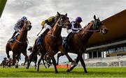 26 June 2020; Delphi, right, with Wayne Lordan up, passes the post to win The Irish Stallion Farms EBF (C & G) Maiden ahead of second place finisher Carrytheone, centre, with Shane Kelly up, during day one of the Dubai Duty Free Irish Derby Festival at The Curragh Racecourse in Kildare. Horse Racing continues behind closed doors following strict protocols having been suspended from March 25 due to the Irish Government's efforts to contain the spread of the Coronavirus (COVID-19) pandemic. Photo by Harry Murphy/Sportsfile