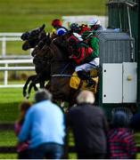 27 June 2020; Runners and riders exit the traps at the start of the Dubai Duty Free Millennium Millionaire Handicap during day two of the Dubai Duty Free Irish Derby Festival at The Curragh Racecourse in Kildare. Horse Racing continues behind closed doors following strict protocols having been suspended from March 25 due to the Irish Government's efforts to contain the spread of the Coronavirus (COVID-19) pandemic. Photo by Harry Murphy/Sportsfile