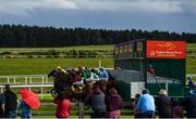 27 June 2020; Runners and riders exit the traps at the start of the Dubai Duty Free Millennium Millionaire Handicap during day two of the Dubai Duty Free Irish Derby Festival at The Curragh Racecourse in Kildare. Horse Racing continues behind closed doors following strict protocols having been suspended from March 25 due to the Irish Government's efforts to contain the spread of the Coronavirus (COVID-19) pandemic. Photo by Harry Murphy/Sportsfile