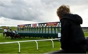 27 June 2020; Runners and riders exit the traps as a young supporter looks on at the start of the GAIN First Flier Stakes during day two of the Dubai Duty Free Irish Derby Festival at The Curragh Racecourse in Kildare. Horse Racing continues behind closed doors following strict protocols having been suspended from March 25 due to the Irish Government's efforts to contain the spread of the Coronavirus (COVID-19) pandemic. Photo by Harry Murphy/Sportsfile