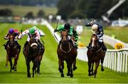 28 June 2020; Strong Johnson, with Colin Keane up, centre, race alongside eventual second Jungle Jane, with Billy Lee up, left, and eventual third Urban Beat, with Ben Coen up, right, on their way to winning the Paddy Power Rockingham Handicap race race during day three of the Dubai Duty Free Irish Derby Festival at The Curragh Racecourse in Kildare. Horse Racing continues behind closed doors following strict protocols having been suspended from March 25 due to the Irish Government's efforts to contain the spread of the Coronavirus (COVID-19) pandemic. Photo by David Fitzgerald/Sportsfile