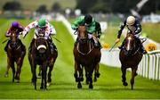 28 June 2020; Strong Johnson, with Colin Keane up, centre, race alongside eventual second Jungle Jane, with Billy Lee up, left, and eventual third Urban Beat, with Ben Coen up, right, on their way to winning the Paddy Power Rockingham Handicap race race during day three of the Dubai Duty Free Irish Derby Festival at The Curragh Racecourse in Kildare. Horse Racing continues behind closed doors following strict protocols having been suspended from March 25 due to the Irish Government's efforts to contain the spread of the Coronavirus (COVID-19) pandemic. Photo by David Fitzgerald/Sportsfile