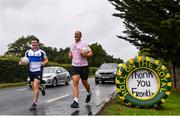 28 June 2020; Rory O'Connor of Rory Stories with a member of Skryne GAA Club during the Solo For Livie Challenge in Ballymagarvey, Meath. The fundraising event is in support of 9 month old Livie Mulhern, from Balrath in Meath. Livie has been diagnosed with a rare and serious genetic neuromuscular condition called spinal muscular atrophy (SMA) type 1. SMA is caused by a gene deletion which results in deterioration of Livie’s nerve cells connecting her brain and spinal cord to her body’s muscles. The money raised from the event will be put towards a once-off gene therapy called Zolgensma, which is currently only available in the USA. It is the worlds most expensive treatment at a cost of $2,100,000. Photo by Ramsey Cardy/Sportsfile