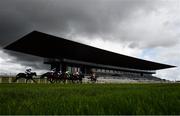 28 June 2020; Runners and riders make their way past the main stand during the Weatherbys Ireland Greenlands Stakes race during day three of the Dubai Duty Free Irish Derby Festival at The Curragh Racecourse in Kildare. Horse Racing continues behind closed doors following strict protocols having been suspended from March 25 due to the Irish Government's efforts to contain the spread of the Coronavirus (COVID-19) pandemic. Photo by David Fitzgerald/Sportsfile