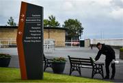 28 June 2020; Cleaner Alex Jorge sanitises a bench during day three of the Dubai Duty Free Irish Derby Festival at The Curragh Racecourse in Kildare. Horse Racing continues behind closed doors following strict protocols having been suspended from March 25 due to the Irish Government's efforts to contain the spread of the Coronavirus (COVID-19) pandemic. Photo by David Fitzgerald/Sportsfile