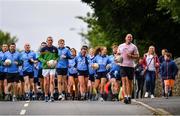 28 June 2020; Rory O'Connor of Rory Stories and Meath football manager Andy McEntee, left, with members of Garristown GAA Club during the Solo For Livie Challenge in Garristown, Meath. The fundraising event is in support of 9 month old Livie Mulhern, from Balrath in Meath. Livie has been diagnosed with a rare and serious genetic neuromuscular condition called spinal muscular atrophy (SMA) type 1. SMA is caused by a gene deletion which results in deterioration of Livie’s nerve cells connecting her brain and spinal cord to her body’s muscles. The money raised from the event will be put towards a once-off gene therapy called Zolgensma, which is currently only available in the USA. It is the worlds most expensive treatment at a cost of $2,100,000. Photo by Ramsey Cardy/Sportsfile