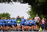 28 June 2020; Rory O'Connor of Rory Stories and Meath football manager Andy McEntee, left, with members of Garristown GAA Club during the Solo For Livie Challenge in Garristown, Meath. The fundraising event is in support of 9 month old Livie Mulhern, from Balrath in Meath. Livie has been diagnosed with a rare and serious genetic neuromuscular condition called spinal muscular atrophy (SMA) type 1. SMA is caused by a gene deletion which results in deterioration of Livie’s nerve cells connecting her brain and spinal cord to her body’s muscles. The money raised from the event will be put towards a once-off gene therapy called Zolgensma, which is currently only available in the USA. It is the worlds most expensive treatment at a cost of $2,100,000. Photo by Ramsey Cardy/Sportsfile