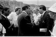 25 June 1990; Officials, including FAI official Donie Butler, right, speak as Republic of Ireland queue for match tickets prior to the FIFA World Cup 1990 Round of 16 match between Republic of Ireland and Romania at the Stadio Luigi Ferraris in Genoa, Italy. Photo by Ray McManus/Sportsfile