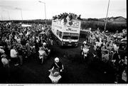 1 July 1990; The Republic of Ireland squad open top bus makes it's way over the central reservation of the motorway from Dublin Airport to College Green in Dublin city centre while being cheered by supporterson their arrival home for a homecoming reception after their participation in the 1990 FIFA World Cup Finals in Italy. Photo by Ray McManus/Sportsfile