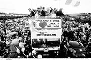 1 July 1990; The Republic of Ireland squad are cheered by supporters as they are brought by open top bus from Dublin Airport to College Green in Dublin city centre on their arrival home for a homecoming reception after their participation in the 1990 FIFA World Cup Finals in Italy. Photo by Ray McManus/Sportsfile