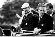 1 July 1990; Republic of Ireland manager Jack Charlton, left, and captain Mick McCarthy as they are brought by open top bus from Dublin Airport to College Green in Dublin city centre on their arrival home for a homecoming reception after their participation in the 1990 FIFA World Cup Finals in Italy. Photo by Ray McManus/Sportsfile