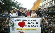 1 July 1990; Mick McCarthy and members of the Republic of Ireland squad are cheered by supporters as they are brought by open top bus down O'Connell Street to College Green in Dublin city centre on their arrival home for a homecoming reception after their participation in the 1990 FIFA World Cup Finals in Italy. Photo by Ray McManus/Sportsfile