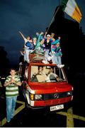 1 July 1990; Republic of Ireland supporters cheer on their team as they are brought by open top bus from Dublin Airport to College Green in Dublin city centre on their arrival home for a homecoming reception after their participation in the 1990 FIFA World Cup Finals in Italy. Photo by Ray McManus/Sportsfile