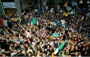 1 July 1990; Republic of Ireland supporters cheer on their team as they are brought by open top bus from Dublin Airport to College Green in Dublin city centre on their arrival home for a homecoming reception after their participation in the 1990 FIFA World Cup Finals in Italy. Photo by Ray McManus/Sportsfile