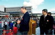 1 July 1990; Republic of Ireland manager Jack Charlton signs an autograph at Dublin Airport as FAI President Fran Fields looks on, on their arrival home for a homecoming reception after their participation in the 1990 FIFA World Cup Finals in Italy. Photo by Ray McManus/Sportsfile