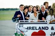 1 July 1990; The Republic of Ireland squad, including Kevin Moran, Ronnie Whelan, Mick Byrne and Gerry Peyton, are brought by open top bus from Dublin Airport to College Green in Dublin city centre on their arrival home for a homecoming reception after their participation in the 1990 FIFA World Cup Finals in Italy. Photo by Ray McManus/Sportsfile