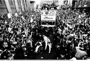 1 July 1990; The Republic of Ireland squad are cheered by supporters as they arrive into College Green in Dublin city centre for a homecoming reception after their participation in the 1990 FIFA World Cup Finals in Italy. Photo by Ray McManus/Sportsfile