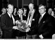 1 July 1990; Republic of Ireland manager Jack Charlton accepts a gift from An Tánaiste Tánaiste Brian Lenihan T.D., left, Minister of State at the Department of Education Frank Fahy, T.D., and Heiner Harding, Marketing Director of Galway Irish Crystal, right, during a homecoming reception on College Green in Dublin after their participation in the 1990 FIFA World Cup Finals in Italy. Photo by Ray McManus/Sportsfile