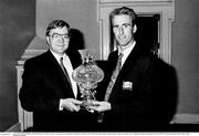 1 July 1990; Heiner Harding, Marketing Director of Galway Irish Crystal, makes a presentation to Republic of Ireland captain Mick McCarthy during a homecoming reception on College Green in Dublin after their participation in the 1990 FIFA World Cup Finals in Italy. Photo by Ray McManus/Sportsfile