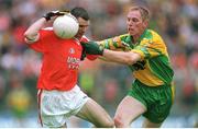 7 July 2002; Steven McDonnell, Armagh in action against Noel McGinley, Donegal, Armagh v Donegal, Ulster Football Final, St Tighearnachs Park, Clones, Co. Monaghan. Photo by David Maher/Sportsfile