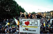 1 July 1990; Members of the Republic of Ireland squad, including manager Jack Charlton, Frank Stapleton and John Byrne, are cheered by supporters as they are brought by open top bus through Drumcondra to College Green in Dublin city centre on their arrival home for a homecoming reception after their participation in the 1990 FIFA World Cup Finals in Italy. Photo by Ray McManus/Sportsfile