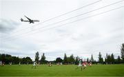 12 July 2020; A Qatar Airways plane comes into land at Dublin Airport during the U17 Club Friendly match between Shelbourne and Bray Wanderers at AUL Complex in Clonsaugh, Dublin. Photo by Stephen McCarthy/Sportsfile