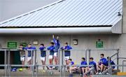 17 July 2020; Some of the Naas CBS substitutes look on from the terrace during the Leinster GAA Colleges Senior A Football Final match between Naas CBS and St Joseph's SS, Rochfortbridge at Bord na Móna O'Connor Park in Tullamore, Offaly. Competitive GAA matches have been approved to return following the guidelines of Phase 3 of the Irish Government’s Roadmap for Reopening of Society and Business and protocols set down by the GAA governing authorities. With games having been suspended since March, competitive games can take place with updated protocols including a limit of 200 individuals at any one outdoor event, including players, officials and a limited number of spectators, with social distancing, hand sanitisation and face masks being worn by those in attendance among other measures in an effort to contain the spread of the Coronavirus (COVID-19) pandemic. Photo by Piaras Ó Mídheach/Sportsfile