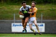 17 July 2020; Ryan Johnston of Kilcoo in action against Ruairí Lively of Clonduff during the Down County Senior Football League Division 1A match between Clonduff and Kilcoo at Clonduff Park in Newry, Down. Competitive GAA matches have been approved to return following the guidelines of Northern Ireland’s COVID-19 recovery plan and protocols set down by the GAA governing authorities. With games having been suspended since March, competitive games can take place with updated protocols with only players, officials and essential personnel permitted to attend, social distancing, hand sanitisation and face masks being worn by those in attendance in an effort to contain the spread of the Coronavirus (COVID-19) pandemic. Photo by Sam Barnes/Sportsfile