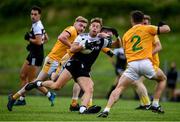 17 July 2020; Jerome Johnston of Kilcoo in action against, from left, Paul Lively, Shane McGreevy and Lorcan Branagan of Clonduff during the Down County Senior Football League Division 1A match between Clonduff and Kilcoo at Clonduff Park in Newry, Down. Competitive GAA matches have been approved to return following the guidelines of Northern Ireland’s COVID-19 recovery plan and protocols set down by the GAA governing authorities. With games having been suspended since March, competitive games can take place with updated protocols with only players, officials and essential personnel permitted to attend, social distancing, hand sanitisation and face masks being worn by those in attendance in an effort to contain the spread of the Coronavirus (COVID-19) pandemic. Photo by Sam Barnes/Sportsfile