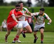 17 July 2020; William Quaile of Tinahely in action against Padraig O'Toole and andy Foley of Kiltegan during the Wicklow County Senior Football Championship Round 1 match between Tinahely and Kiltegan at Baltinglass GAA Club in Baltinglass, Wicklow. Competitive GAA matches have been approved to return following the guidelines of Phase 3 of the Irish Government’s Roadmap for Reopening of Society and Business and protocols set down by the GAA governing authorities. With games having been suspended since March, competitive games can take place with updated protocols including a limit of 200 individuals at any one outdoor event, including players, officials and a limited number of spectators, with social distancing, hand sanitisation and face masks being worn by those in attendance among other measures in an effort to contain the spread of the Coronavirus (COVID-19) pandemic. Photo by Matt Browne/Sportsfile