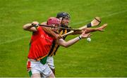 18 July 2020; Nick Doyle of Rapparees-Starlights in action against Glen Malone of Shelmaliers during the Wexford County Senior Hurling Championship Group D Round 1 match between Rapparees-Starlights and Shelmaliers at Chadwicks Wexford Park in Wexford. Competitive GAA matches have been approved to return following the guidelines of Phase 3 of the Irish Government’s Roadmap for Reopening of Society and Business and protocols set down by the GAA governing authorities. With games having been suspended since March, competitive games can take place with updated protocols including a limit of 200 individuals at any one outdoor event, including players, officials and a limited number of spectators, with social distancing, hand sanitisation and face masks being worn by those in attendance among other measures in an effort to contain the spread of the Coronavirus (COVID-19) pandemic. Photo by Sam Barnes/Sportsfile