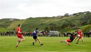 18 July 2020; Andrew McClean of Kilcar sees his shot saved by Kevin Martin of Killybegs during the Donegal County Divisional League Division 1 Section B match between Kilcar and Killybegs at Towney Park in Kilcar, Donegal. Competitive GAA matches have been approved to return following the guidelines of Phase 3 of the Irish Government’s Roadmap for Reopening of Society and Business and protocols set down by the GAA governing authorities. With games having been suspended since March, competitive games can take place with updated protocols including a limit of 200 individuals at any one outdoor event, including players, officials and a limited number of spectators, with social distancing, hand sanitisation and face masks being worn by those in attendance among other measures in an effort to contain the spread of the Coronavirus (COVID-19) pandemic. Photo by Seb Daly/Sportsfile