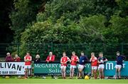 18 July 2020; Cuala substitutes watch on during the Dublin County Senior Hurling Championship Group 4 Round 1 match between Cuala and Thomas Davis at Bray Emmets GAA club in Bray, Wicklow. Competitive GAA matches have been approved to return following the guidelines of Phase 3 of the Irish Government’s Roadmap for Reopening of Society and Business and protocols set down by the GAA governing authorities. With games having been suspended since March, competitive games can take place with updated protocols including a limit of 200 individuals at any one outdoor event, including players, officials and a limited number of spectators, with social distancing, hand sanitisation and face masks being worn by those in attendance among other measures in an effort to contain the spread of the Coronavirus (COVID-19) pandemic. Photo by Ramsey Cardy/Sportsfile