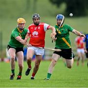 18 July 2020; Colm Sheanon of Cuala in action against Jacques Dalton, left, and Gavin Carruth of Thomas Davis during the Dublin County Senior Hurling Championship Group 4 Round 1 match between Cuala and Thomas Davis at Bray Emmets GAA club in Bray, Wicklow. Competitive GAA matches have been approved to return following the guidelines of Phase 3 of the Irish Government’s Roadmap for Reopening of Society and Business and protocols set down by the GAA governing authorities. With games having been suspended since March, competitive games can take place with updated protocols including a limit of 200 individuals at any one outdoor event, including players, officials and a limited number of spectators, with social distancing, hand sanitisation and face masks being worn by those in attendance among other measures in an effort to contain the spread of the Coronavirus (COVID-19) pandemic. Photo by Ramsey Cardy/Sportsfile