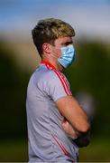 18 July 2020; Injured Athy footballer and athletic therapist Kevin Feely looks on from the sideline during the Kildare County Senior Football League Division 1 Section B Round 1 match between Athy and Sarsfields at Athy GAA Club in Athy in Kildare. Competitive GAA matches have been approved to return following the guidelines of Phase 3 of the Irish Government’s Roadmap for Reopening of Society and Business and protocols set down by the GAA governing authorities. With games having been suspended since March, competitive games can take place with updated protocols including a limit of 200 individuals at any one outdoor event, including players, officials and a limited number of spectators, with social distancing, hand sanitisation and face masks being worn by those in attendance among other measures in an effort to contain the spread of the Coronavirus (COVID-19) pandemic. Photo by Piaras Ó Mídheach/Sportsfile