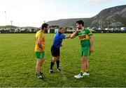 18 July 2020; Referee Shane Toolan is greeted by Ardara captain John Ross Molloy, right, and Naomh Columba captain Michael McGuire during the coin toss prior to the Donegal County Divisional League Division 1 Section B match between Naomh Columba and Ardara at Páirc na nGael in Glencolumbkille, Donegal. Competitive GAA matches have been approved to return following the guidelines of Phase 3 of the Irish Government’s Roadmap for Reopening of Society and Business and protocols set down by the GAA governing authorities. With games having been suspended since March, competitive games can take place with updated protocols including a limit of 200 individuals at any one outdoor event, including players, officials and a limited number of spectators, with social distancing, hand sanitisation and face masks being worn by those in attendance among other measures in an effort to contain the spread of the Coronavirus (COVID-19) pandemic. Photo by Seb Daly/Sportsfile