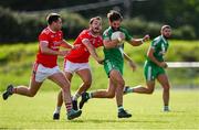 18 July 2020; Conor Hartley of Sarsfields gets past Killian Mulhall, left, and Pascal Connell of Athy during the Kildare County Senior Football League Division 1 Section B Round 1 match between Athy and Sarsfields at Athy GAA Club in Athy in Kildare. Competitive GAA matches have been approved to return following the guidelines of Phase 3 of the Irish Government’s Roadmap for Reopening of Society and Business and protocols set down by the GAA governing authorities. With games having been suspended since March, competitive games can take place with updated protocols including a limit of 200 individuals at any one outdoor event, including players, officials and a limited number of spectators, with social distancing, hand sanitisation and face masks being worn by those in attendance among other measures in an effort to contain the spread of the Coronavirus (COVID-19) pandemic. Photo by Piaras Ó Mídheach/Sportsfile