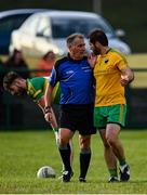 18 July 2020; Michael McGuire of Naomh Columba remonstrates with referee Shane Toolan during the Donegal County Divisional League Division 1 Section B match between Naomh Columba and Ardara at Páirc na nGael in Glencolumbkille, Donegal. Competitive GAA matches have been approved to return following the guidelines of Phase 3 of the Irish Government’s Roadmap for Reopening of Society and Business and protocols set down by the GAA governing authorities. With games having been suspended since March, competitive games can take place with updated protocols including a limit of 200 individuals at any one outdoor event, including players, officials and a limited number of spectators, with social distancing, hand sanitisation and face masks being worn by those in attendance among other measures in an effort to contain the spread of the Coronavirus (COVID-19) pandemic. Photo by Seb Daly/Sportsfile