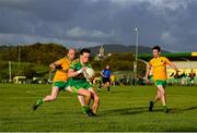 18 July 2020; Johnny Sweeney of Ardara in action against Kieran McBrearty, left, and Philip Doherty of Naomh Columba during the Donegal County Divisional League Division 1 Section B match between Naomh Columba and Ardara at Páirc na nGael in Glencolumbkille, Donegal. Competitive GAA matches have been approved to return following the guidelines of Phase 3 of the Irish Government’s Roadmap for Reopening of Society and Business and protocols set down by the GAA governing authorities. With games having been suspended since March, competitive games can take place with updated protocols including a limit of 200 individuals at any one outdoor event, including players, officials and a limited number of spectators, with social distancing, hand sanitisation and face masks being worn by those in attendance among other measures in an effort to contain the spread of the Coronavirus (COVID-19) pandemic. Photo by Seb Daly/Sportsfile