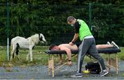 18 July 2020; David Keogh of Thomas Davis receives treatment from team physio Carl O'Toole ahead of the Dublin County Senior Hurling Championship Group 4 Round 1 match between Cuala and Thomas Davis at Bray Emmets GAA club in Bray, Wicklow. Competitive GAA matches have been approved to return following the guidelines of Phase 3 of the Irish Government’s Roadmap for Reopening of Society and Business and protocols set down by the GAA governing authorities. With games having been suspended since March, competitive games can take place with updated protocols including a limit of 200 individuals at any one outdoor event, including players, officials and a limited number of spectators, with social distancing, hand sanitisation and face masks being worn by those in attendance among other measures in an effort to contain the spread of the Coronavirus (COVID-19) pandemic. Photo by Ramsey Cardy/Sportsfile