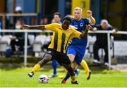 19 July 2020; George Mukete of Ballymun United in action against Sean Byrne of Bluebell United during the Leinster Senior League Senior Sunday Division match between Bluebell United and Ballymun United at Capco Park in Bluebell, Dublin.  Photo by Sam Barnes/Sportsfile