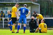 19 July 2020; Rian Ashe of Ballymun United, right, shares a joke with team-mate Sean Heaney, whilst receiving treatment from physio Marc Cervi during the Leinster Senior League Senior Sunday Division match between Bluebell United and Ballymun United at Capco Park in Bluebell, Dublin.  Photo by Sam Barnes/Sportsfile