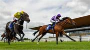 19 July 2020; Snowfall, right, with Wayne Lordan up, races alongside eventual second place Sister Rosetta, with Colin Keane up, on their way to winning the Irish Stallion Farms EBF Fillies Maiden at The Curragh Racecourse in Kildare. Racing remains behind closed doors to the public under guidelines of the Irish Government in an effort to contain the spread of the Coronavirus (COVID-19) pandemic. Photo by Seb Daly/Sportsfile