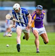 19 July 2020; Niall Ryan of Ballyboden St Enda's in action against Naomhan O'Riordan of Kilmacud Crokes during the Dublin County Senior Hurling Championship Round 1 match between Ballyboden St Enda's and Kilmacud Crokes at Parnell Park in Dublin. Competitive GAA matches have been approved to return following the guidelines of Phase 3 of the Irish Government’s Roadmap for Reopening of Society and Business and protocols set down by the GAA governing authorities. With games having been suspended since March, competitive games can take place with updated protocols including a limit of 200 individuals at any one outdoor event, including players, officials and a limited number of spectators, with social distancing, hand sanitisation and face masks being worn by those in attendance among other measures in an effort to contain the spread of the Coronavirus (COVID-19) pandemic. Photo by Ramsey Cardy/Sportsfile