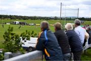 19 July 2020; A general view of the action as supporters watch on from outside the ground during the Armagh County Senior Football League Group A Round 1 match between Maghery Sean McDermotts and Crossmaglen Rangers at Felix Hamill Park in Maghery, Armagh. Competitive GAA matches have been approved to return following the guidelines of Northern Ireland’s COVID-19 recovery plan and protocols set down by the GAA governing authorities. With games having been suspended since March, competitive games can take place with updated protocols with only players, officials and essential personnel permitted to attend, social distancing, hand sanitisation and face masks being worn by those in attendance in an effort to contain the spread of the Coronavirus (COVID-19) pandemic. Photo by Stephen McCarthy/Sportsfile