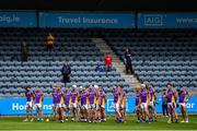 19 July 2020; The Kilmacud Crokes team during the National Anthem ahead of the Dublin County Senior Hurling Championship Round 1 match between Ballyboden St Enda's and Kilmacud Crokes at Parnell Park in Dublin. Competitive GAA matches have been approved to return following the guidelines of Phase 3 of the Irish Government’s Roadmap for Reopening of Society and Business and protocols set down by the GAA governing authorities. With games having been suspended since March, competitive games can take place with updated protocols including a limit of 200 individuals at any one outdoor event, including players, officials and a limited number of spectators, with social distancing, hand sanitisation and face masks being worn by those in attendance among other measures in an effort to contain the spread of the Coronavirus (COVID-19) pandemic. Photo by Ramsey Cardy/Sportsfile