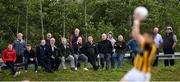 19 July 2020; Supporters watch on from outside the ground during the Armagh County Senior Football League Group A Round 1 match between Maghery Sean McDermotts and Crossmaglen Rangers at Felix Hamill Park in Maghery, Armagh. Competitive GAA matches have been approved to return following the guidelines of Northern Ireland’s COVID-19 recovery plan and protocols set down by the GAA governing authorities. With games having been suspended since March, competitive games can take place with updated protocols with only players, officials and essential personnel permitted to attend, social distancing, hand sanitisation and face masks being worn by those in attendance in an effort to contain the spread of the Coronavirus (COVID-19) pandemic. Photo by Stephen McCarthy/Sportsfile