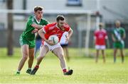 18 July 2020; John Moran of Athy in action against Ronan Fitzgibbon of Sarsfields during the Kildare County Senior Football League Division 1 Section B Round 1 match between Athy and Sarsfields at Athy GAA Club in Athy in Kildare. Competitive GAA matches have been approved to return following the guidelines of Phase 3 of the Irish Government’s Roadmap for Reopening of Society and Business and protocols set down by the GAA governing authorities. With games having been suspended since March, competitive games can take place with updated protocols including a limit of 200 individuals at any one outdoor event, including players, officials and a limited number of spectators, with social distancing, hand sanitisation and face masks being worn by those in attendance among other measures in an effort to contain the spread of the Coronavirus (COVID-19) pandemic. Photo by Piaras Ó Mídheach/Sportsfile